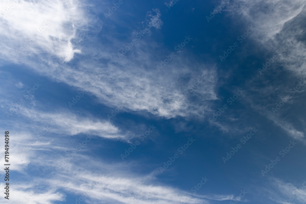 sunny weather with white clouds on a blue sky background