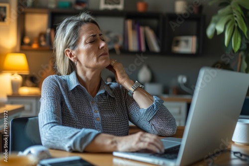 Overworked Mature Businesswoman In Pain From Poor Posture While Working From Home