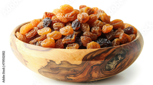 Wooden bowl filled with raisins on white surface. Perfect for food and nutrition-related projects