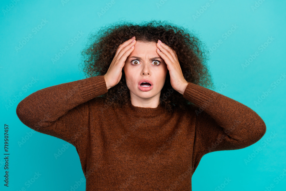 Portrait of young funny girl staring when see how much work her colleagues left after holidays isolated on aquamarine color background