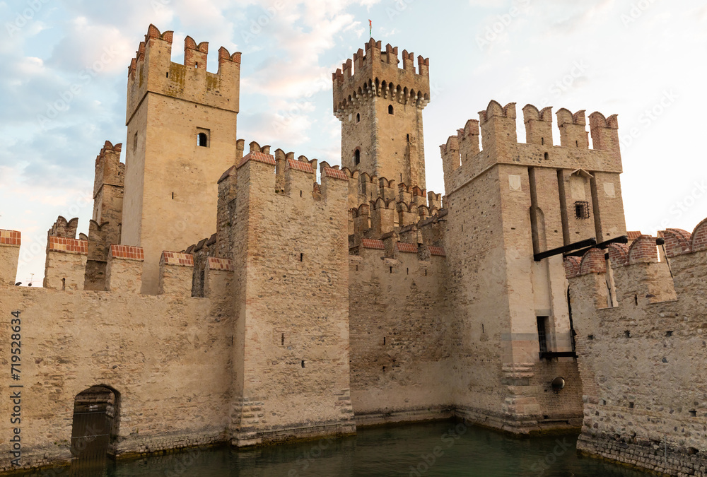 Sirmione, Italy - castle on Garda lake. Scenic mediaeval building on the water