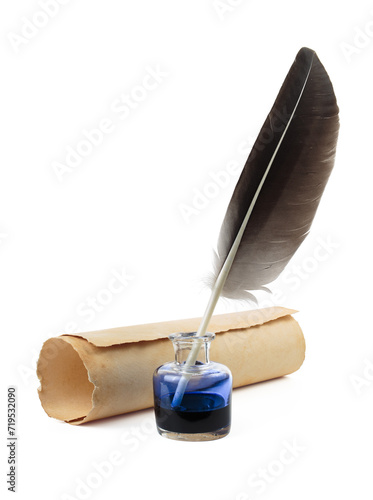 Feather with parchment and inkwell isolated on a background