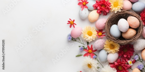 Colorful easter eggs with flowers in a basket