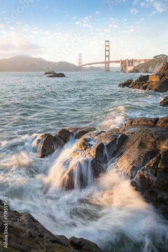 Golden Gate Bridge during sunset with crashing waves, new San Fransisco, California, USA
The Golden Gate Bridge is the most famous attraction.
Traveling concept background. photo