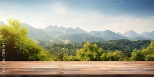 Empty table with mountain backdrop  sunny sky  and foliage.