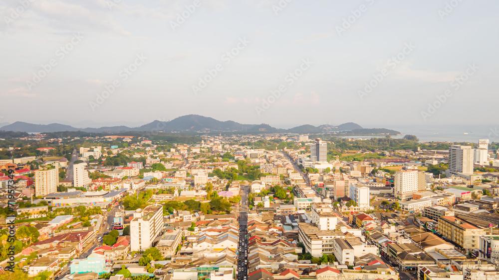 Fototapeta premium Aerial view, drone flying over Phuket city, Thailand. Drone over SinoPortugyese It's a Sunday in Phuket and tourists go shopping on the old streets filled with local merchants selling food and clothes