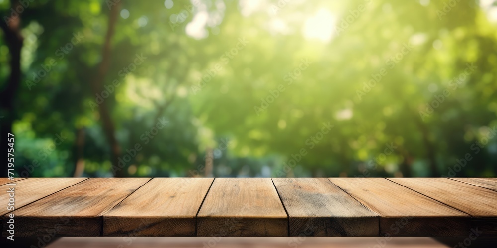 Country outdoor themed wooden table with blurred green background used for product display. Country outdoor themed wooden table with blurred green background used for product display.