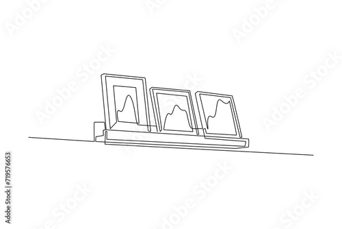 Single continuous line drawing of wall photo display in bedroom. Luxurious interior. interior decoration minimalist concept. Bedroom. Very cozy rooms. Staycation. One line design vector illustration