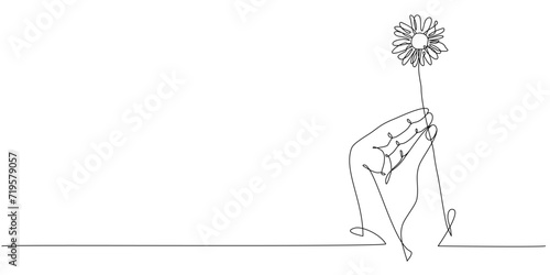 Vector one line art illustration of a silhouette hand holding flower on white backgroundhand drawn flower photo