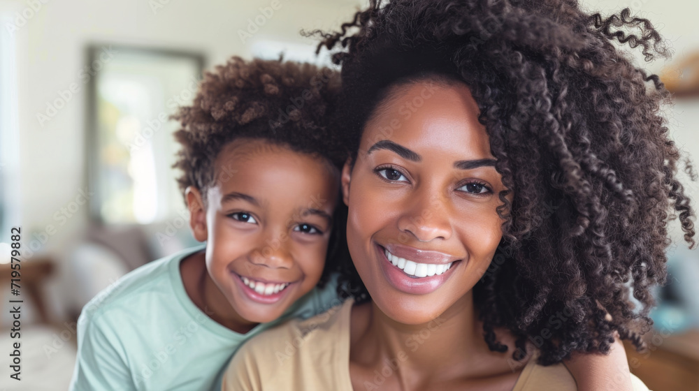 smiling woman and a young girl with curly hair smiling woman and a young girl with curly hair