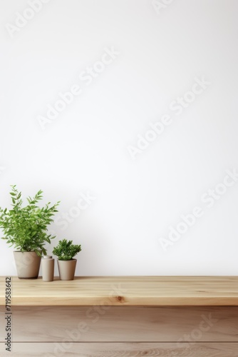 Empty wooden sage table over white wall background © Lenhard