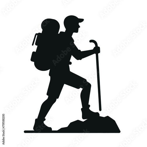 Hiker Silhouette Trekking Uphill with Stick
