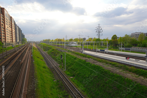 railroad tracks surrounded by grass