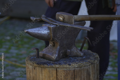 anvil on a stump and a hammer