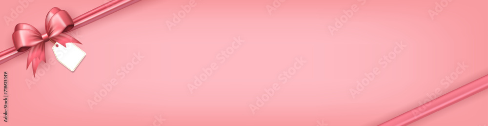 Panoramic banner with pink bow ribbon and paper label tag in the corner as frame and copy space for text on soft pink background. Greeting card, header with gift box with realistic 3d bow and sticker