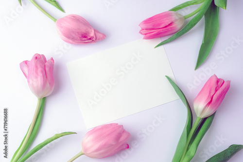 Fototapeta Naklejka Na Ścianę i Meble -  Blank card and pink tulips, spring holidays concept. Top view, flat lay, mockup