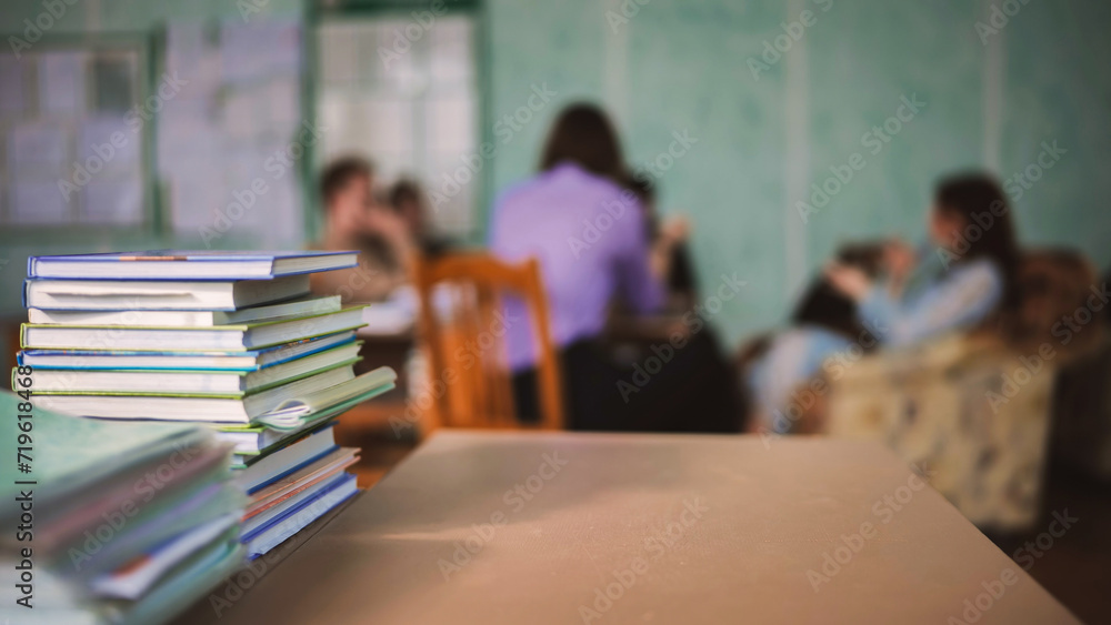 Students during recess against a background of books and notebooks. Students during recess against a background of books and notebooks.