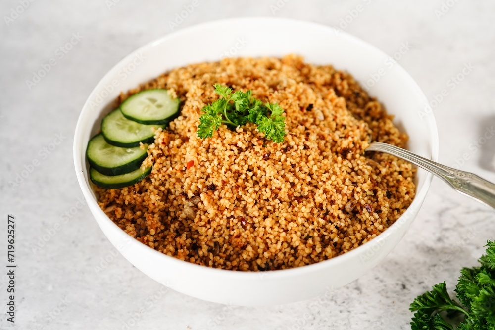 Homemade Moroccan couscous served in a bowl, selective focus Homemade Moroccan couscous served in a bowl, selective focus