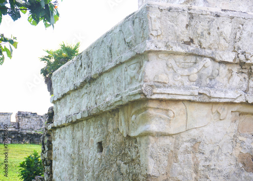 Tulum, Quintana Roo, Mexico - December 15, 2023: A face carved into a temple ruin at Tulum, The Maya City of the Dawning Sun. 
