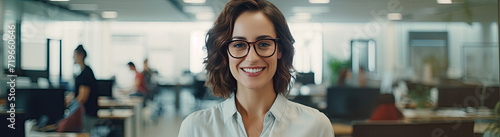 Woman Wearing Glasses Standing in an Office
