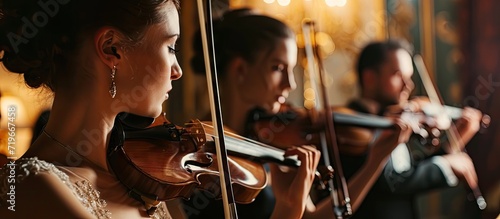 Two musicians playing violins on a wedding reception. Copy space image. Place for adding text photo