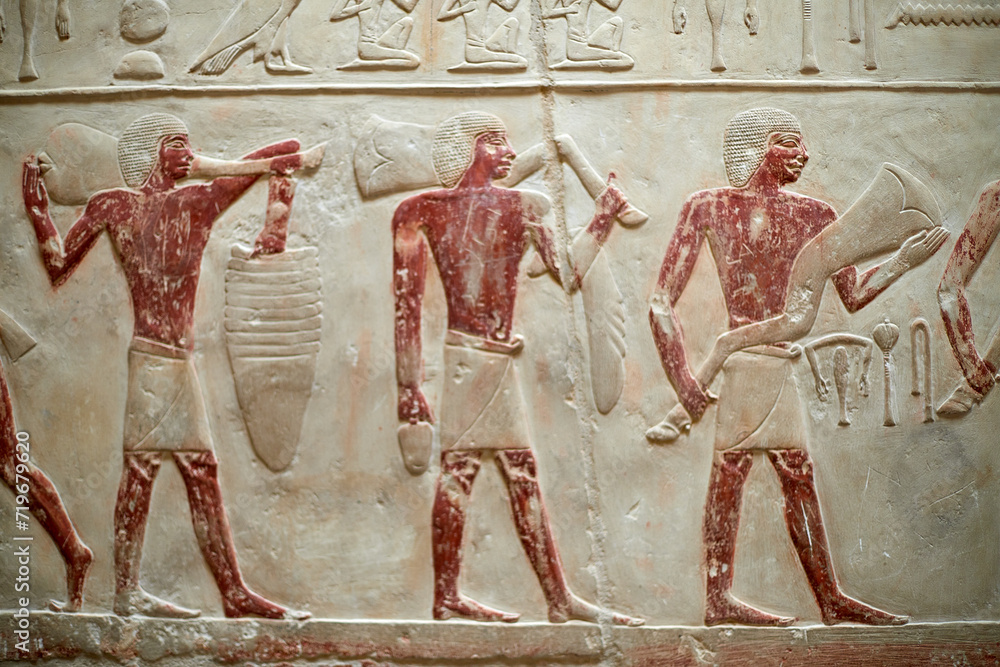 Procession with men carrying meet offerings for the deceased owner of a V Dynasty mastaba - Idut. Saqqara, Egypt - obrazy, fototapety, plakaty 