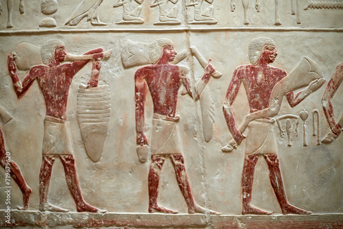 Procession with men carrying meet offerings for the deceased owner of a V Dynasty mastaba - Idut. Saqqara, Egypt photo