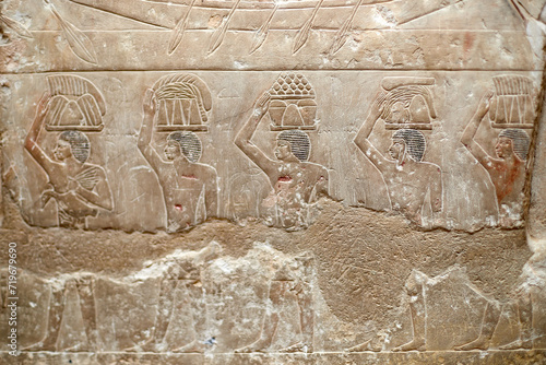 Procession of men carrying food offerings on their heads to the deceased owner of a V Dynasty mastaba - Idut. Saqqara, Egypt