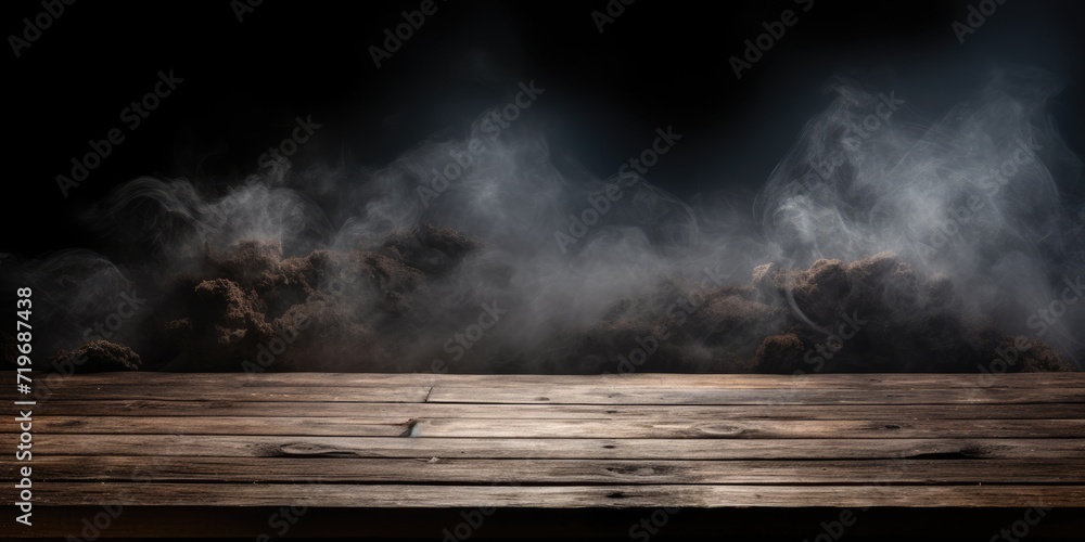 Dark background with smoking old wooden table top.