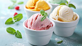 Homemade ice cream with various flavors, served in white bowls garnished with fresh mint leaves, light background