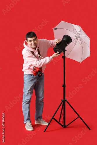 Young male photographer wit...