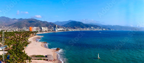 Aerial view of beach with a city in the background