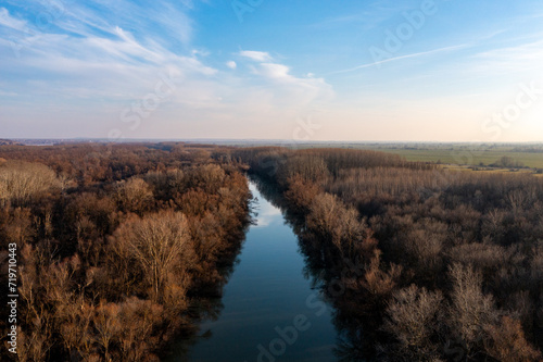 Riverside Reflections  Aerial Snapshot of Danube and Forest Under Sky