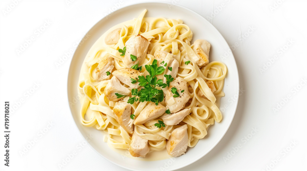 Chicken fettuccine with alfredo sauce, italian pasta on white plate isolated on a white background