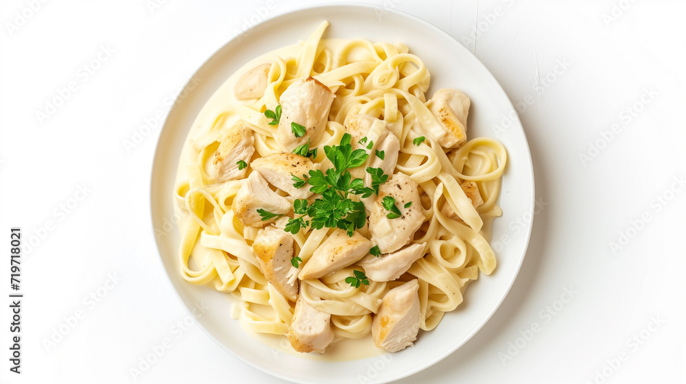 Chicken fettuccine with alfredo sauce, italian pasta on white plate isolated on a white background Chicken fettuccine with alfredo sauce, italian pasta on white plate isolated on a white background