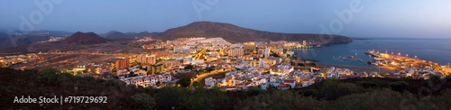 Los Cristianos in the evening at sunset, blue hour, panoramic shot with harbor, volcanoes and sea, Tenerife, Canary Islands, Spain © Andreas