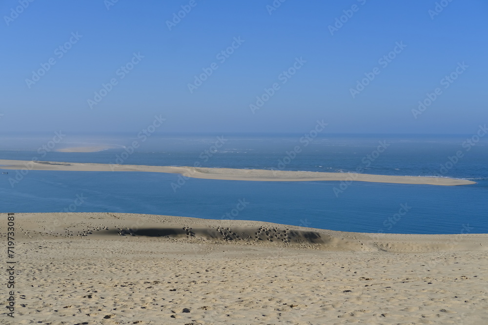 A view from the top of the Pilat dune with a breathtaking view of the Arguin sandbank. La Teste-de-Buch, France - January 25, 2024.