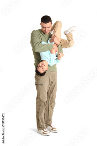 Young man with his little son on white background
