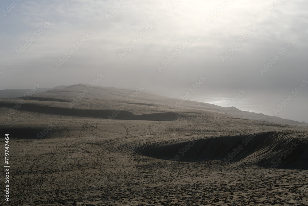 A view from the top of the Pilat dune with some fog on the silver coast. La Teste-de-Buch, France - January 25, 2024. A view from the top of the Pilat dune with some fog on the silver coast. La Teste-de-Buch, France - January 25, 2024.