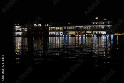 Taj Lake Palace with light reflection at night photo