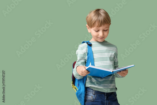 Young schoolboy with backpa...