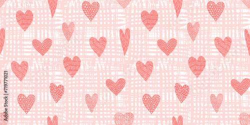 Cute seamless pattern with tender red hand drawn textured hearts on peach textured background. Lovely coral vector texture with doodle heart shapes for St. Valentines wrapping paper, textile © Tatahnka
