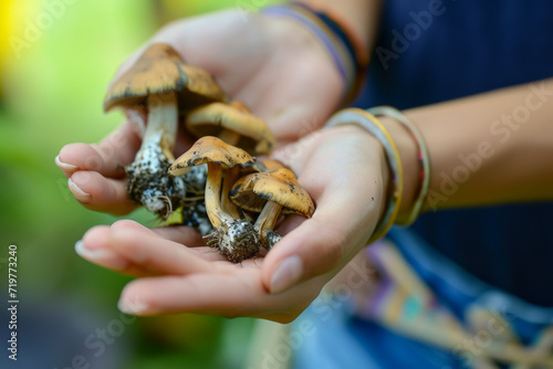 Mushrooms in hands close-up. Background with selective focus and copy space