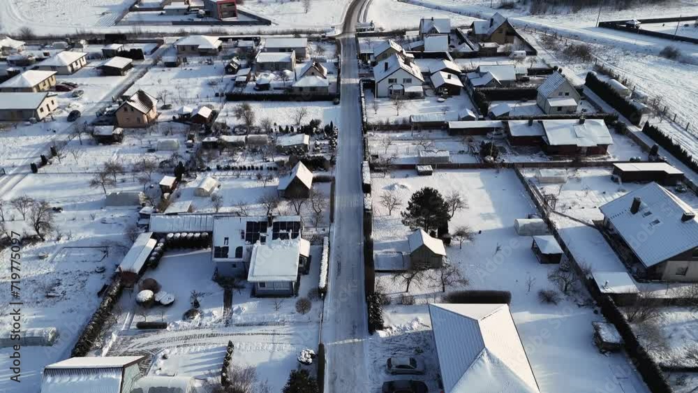 Aerial view of residential streets covered in fresh snow during the winter Aerial view of residential streets covered in fresh snow during the winter