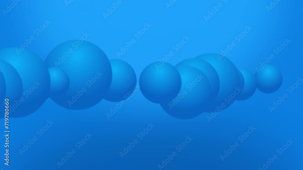 Animation of variable size large blue spheres animation moving across the view from left to right on a gradient background