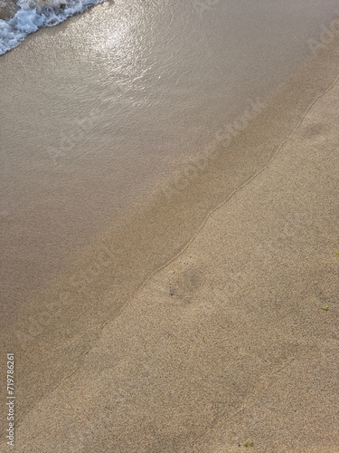 
This is a close-up of the beach sand and waves.