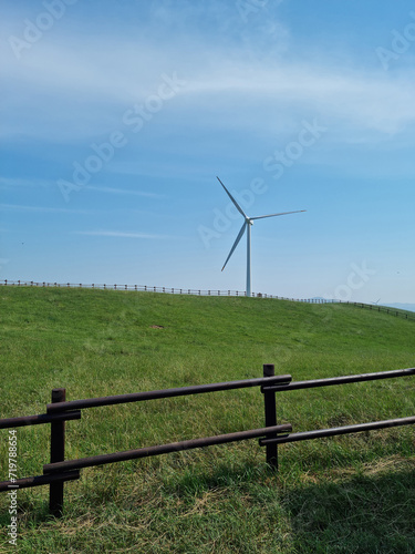  It is a farm with wind turbines.