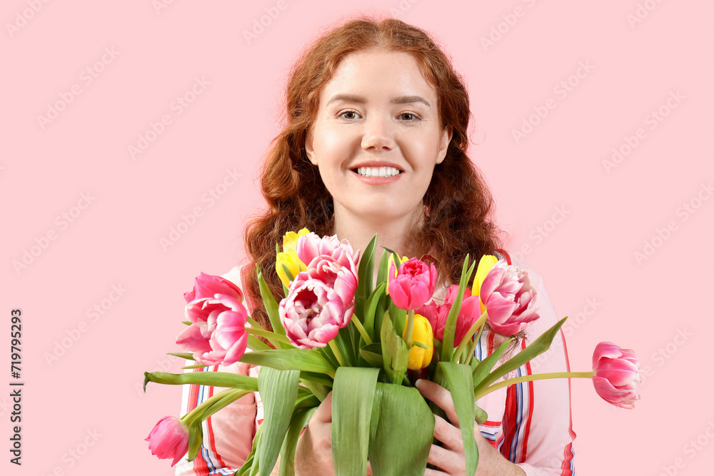 Happy young woman with bouquet of beautiful tulips on pink background. International Women's Day Happy young woman with bouquet of beautiful tulips on pink background. International Women's Day