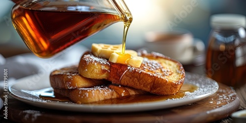 pouring syrup on fresh baked french toast breakfast