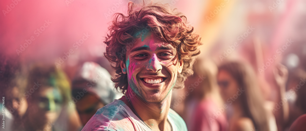 Celebrating a Holi festival with a man with his face covered in colorful paint showing his happiness Celebrating a Holi festival with a man with his face covered in colorful paint showing his happiness